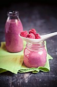 Raspberry smoothies in bottles