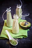 Bottles of apple, avocado and matcha smoothie in bottles