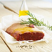Topside of beef, olive oil, garlic and rosemary