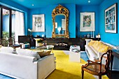 Neoclassical furniture in living room with blue walls and yellow carpet