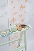 Wallpaper decorated with stencilled butterflies