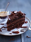 Dark chocolate cream cake with chocolate curls