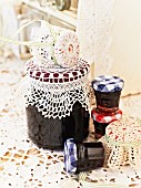 Jars of blackberry jam with lace covers