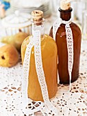 Two bottles of homemade pear syrup