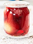 A jar of red wine pears