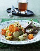 Boiled beef with potatoes, carrots and chives