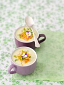 Cream of white asparagus soup with smoked salmon and orange zest
