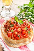 Mini puff pastry pizzas topped with tomatoes, veal and herbs