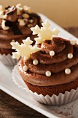 Cupcakes topped with chocolate cream for Christmas
