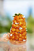 A croquembouche decorated with sugar-coated almonds