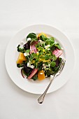 Beetroot and golden beet salad with watercress and goat's cheese