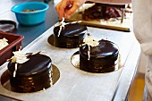 Festive cakes with a dark chocolate glaze