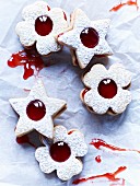 Jammy shortbread biscuits with red jam