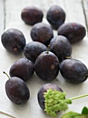 Fresh plums on a fabric napkin