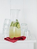 Homemade herb and cucumber lemonade in a carafe