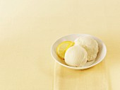 Two scoops of lemon sorbet in a bowl