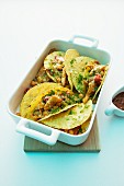 Chicken tacos in a backing dish