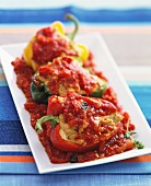 Peppers filled with bread and cheese with tomato sauce