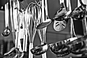 Cooking utensils hanging in a restaurant kitchen