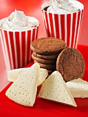 Shortbread and chocolate biscuits with cups of coffee