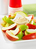 A cashew nut dip with apple wedges