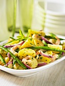 Fried potatoes with green beans and prawns