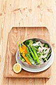 Steamed cod with spring vegetables