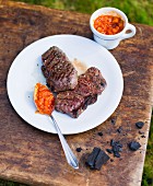 Grilled steaks with a tomato and peach salsa