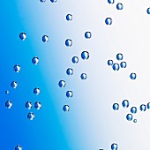 Water droplets on a blue surface, close-up