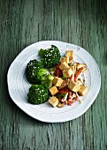 Fried tofu with sesame seeds and broccoli