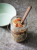 Quinoa salad with tomatoes in a flip-top jar