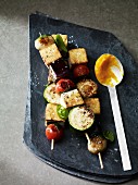 Vegetable skewers with tofu and a ginger and coriander dip