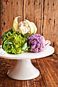 Mini vegetables (cauliflower, Romanesco broccoli) on a cake stand