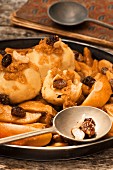 Potato dumplings with baked apple compote
