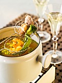 Stock fondue with prawns and vegetables