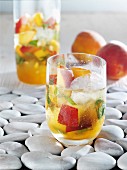 Peach punch with ice cubes