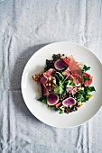 Lentil salad with vegetables and ham (seen from above)