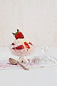 A strawberry yogurt sundae with cream