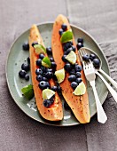 Papaya ships with blueberries and pepper