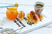 Croissant with marmalade and coffee