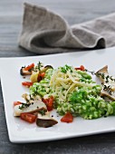 Green risotto with mushrooms, thyme and grated cheese