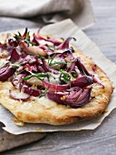 Pizza with red onions and rosemary