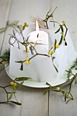 Lantern made from parchment paper and sprigs of mistletoe