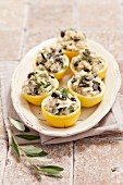 Lemons stuffed with cod and olives