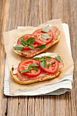 Ciabatta topped with ham and tomatoes