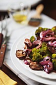 Roasted broccoli and shitake mushrooms on a serving platter