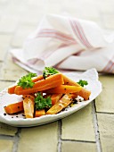 Carrots cooked in orange juice with parsley and black sesame seeds