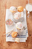 Doughnut cake pops with icing sugar and sprinkles
