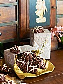 Ginger and chocolate crispy cakes in decorative gift boxes