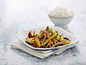 Wok fried pork strips with vegetables and plums (Thailand)